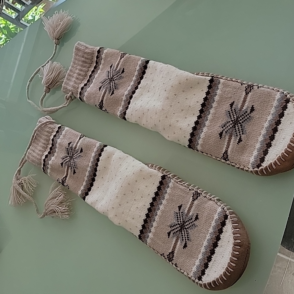Mukluk like knit knee sock slippers.